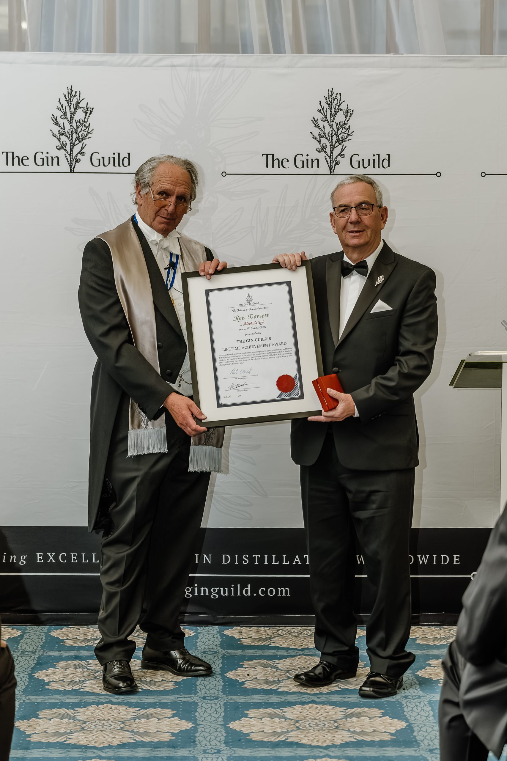 Rob Dorsett receives his Lifetime achievement award from the Gin Guild's Grand Rectifier Charles Maxwell