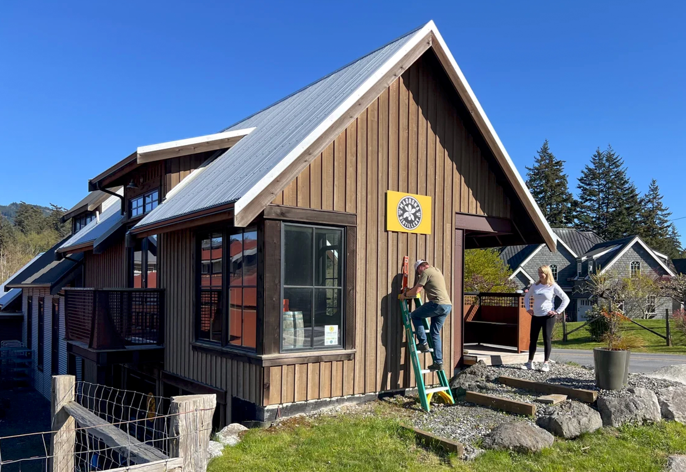 Tom and Anne Allan adding the finishing touches to their new distllery premise on Orcas Island