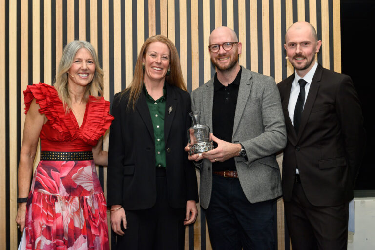 Sarah Prowse presenting Tim Boast from Never Never Distilling with the Melbourne Royal London Dry Gin of the Year award 2026 sponsored by the Gin Guild