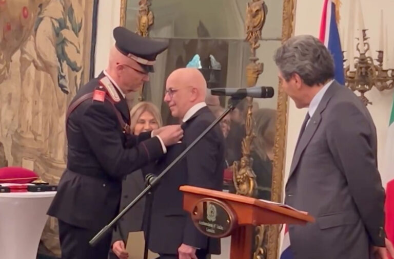 Alessandro Palazzi (centre) receives an award from the Italian Government in 2026